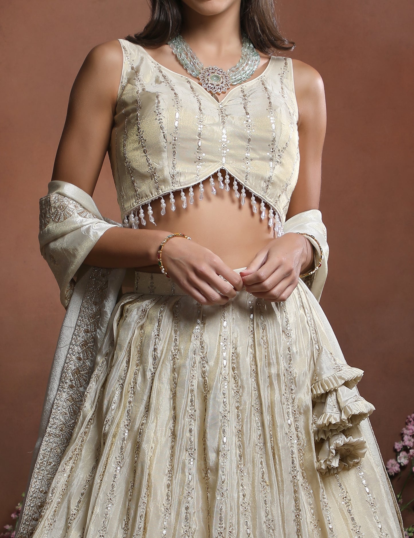 Sleeveless Off-White Embroidered Silk Lehenga