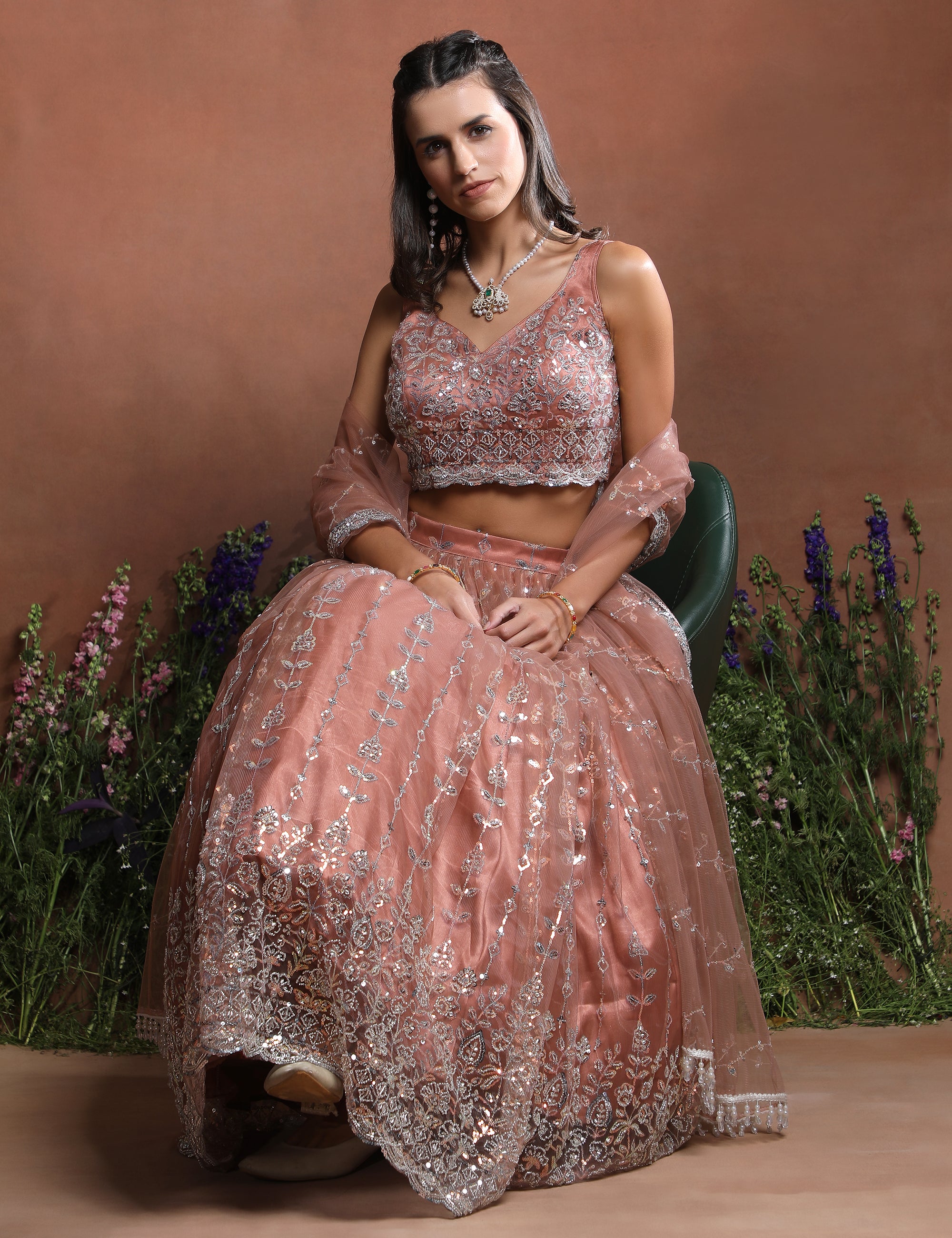 Sleeveless Peach Sparkle Embroidered Net Lehenga